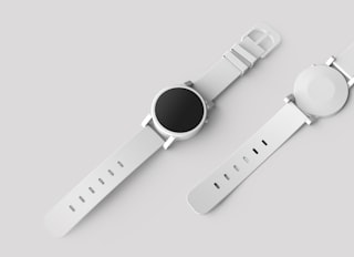 Smart fitness watch with a vivid display on a clean studio surface